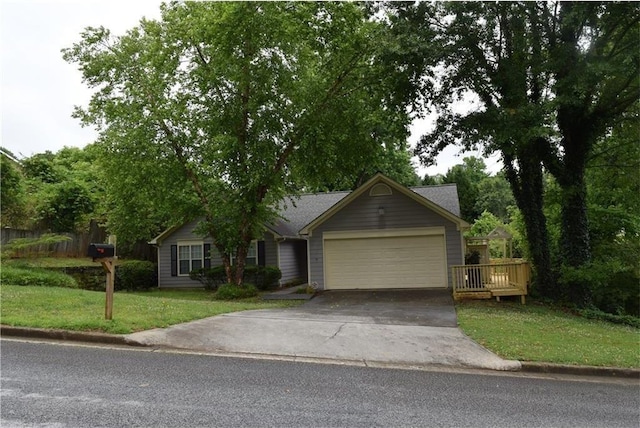 view of front facade featuring a front yard, a garage, and a wooden deck