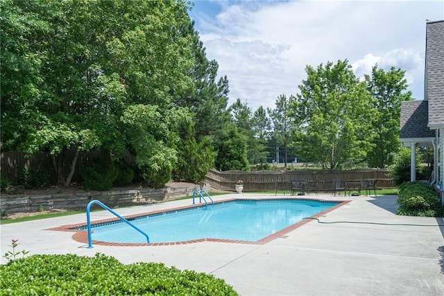 view of pool featuring a fenced in pool, a patio, and fence