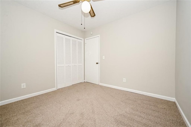 6194 Golden Meadow Ct, Riverdale, GA 30296 - unfurnished bedroom featuring light colored carpet, a closet, and ceiling fan