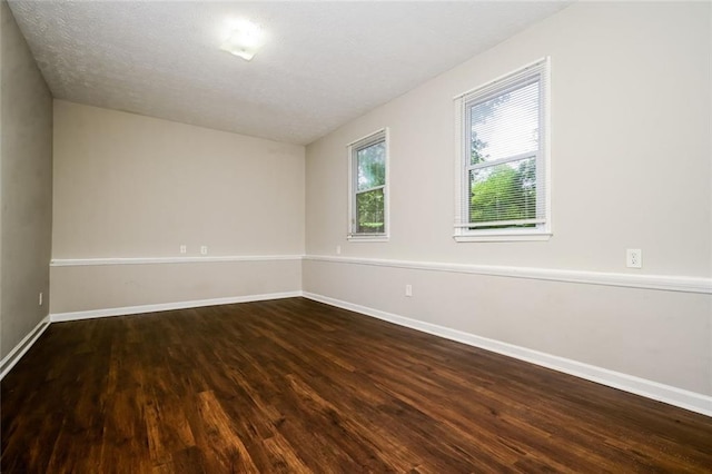 6194 Golden Meadow Ct, Riverdale, GA 30296 - unfurnished room with dark wood-type flooring and baseboards