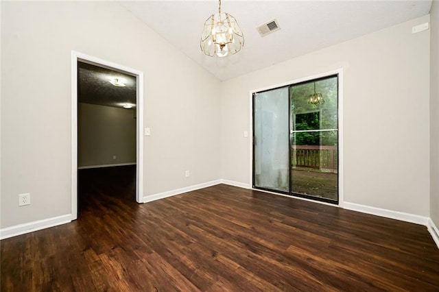 6194 Golden Meadow Ct, Riverdale, GA 30296 - spare room with a chandelier, wood finished floors, and lofted ceiling