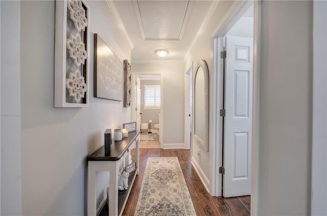 corridor with crown molding, baseboards, and dark wood-style floors