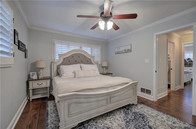 bedroom with baseboards, multiple windows, wood finished floors, and visible vents