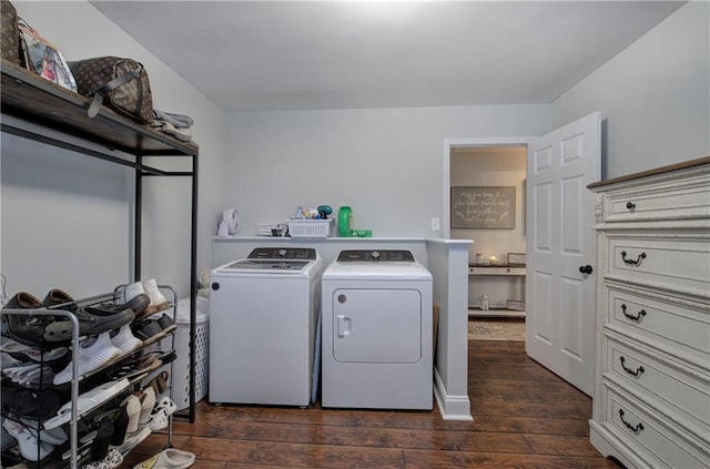 laundry room featuring laundry area, dark wood-type flooring, and independent washer and dryer