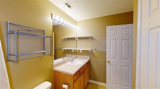 210 Overview Ct, Villa Rica, GA 30180 - bathroom with vanity, toilet, and a textured ceiling