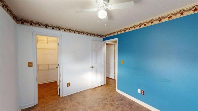 210 Overview Ct, Villa Rica, GA 30180 - unfurnished bedroom featuring a walk in closet, baseboards, and a closet