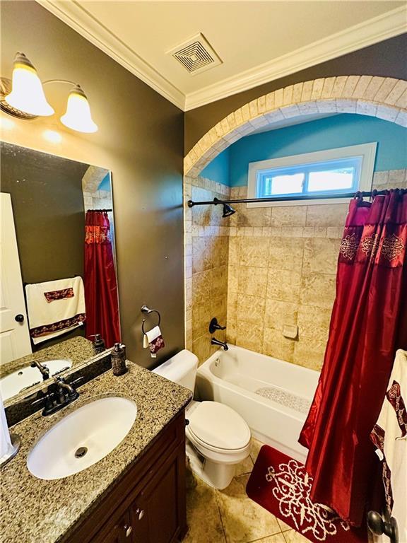 bathroom with visible vents, shower / bath combo with shower curtain, toilet, crown molding, and tile patterned flooring