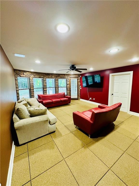 living room with recessed lighting, baseboards, and ceiling fan