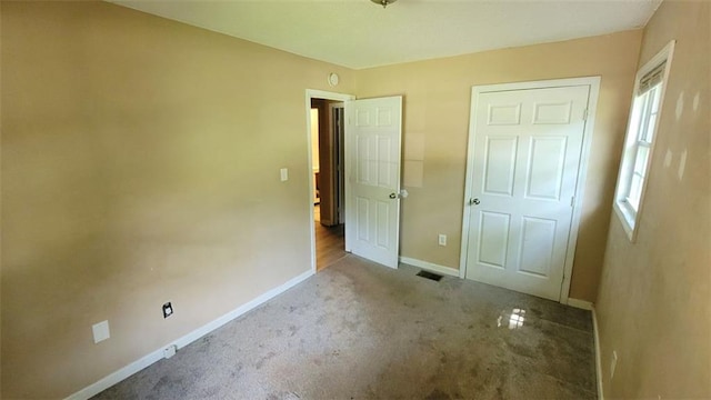 unfurnished bedroom with light carpet