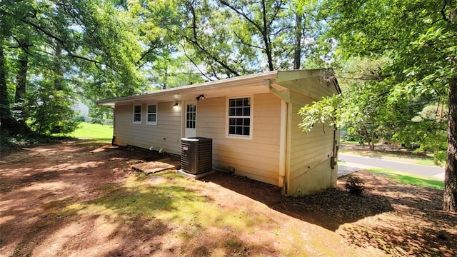 view of property exterior with central AC unit