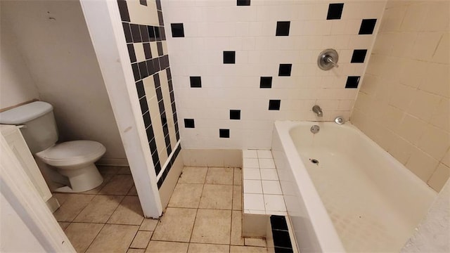 bathroom with tile patterned floors, toilet, and a bathtub