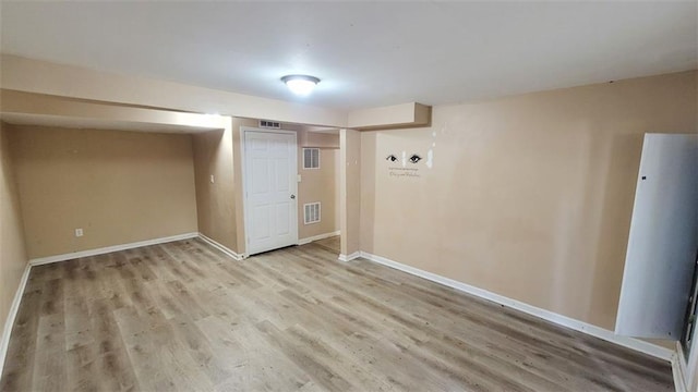 basement featuring light wood-type flooring