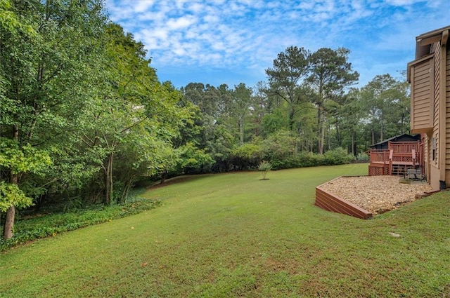 view of yard with a wooden deck