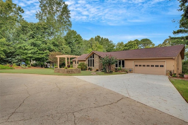 ranch-style home featuring a front yard and a garage