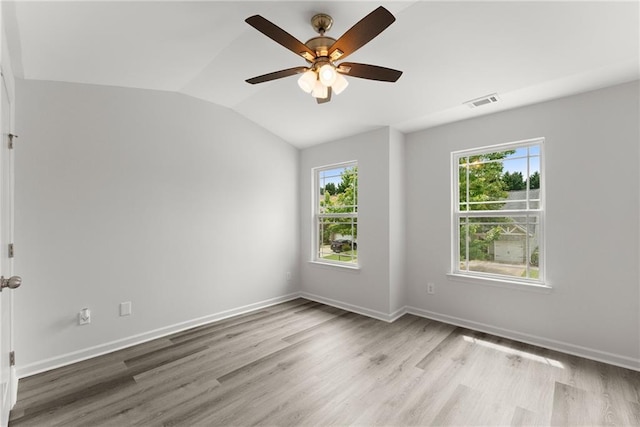 124 Oakmont Dr, Dawsonville, GA 30534 - unfurnished room with plenty of natural light, light wood finished floors, vaulted ceiling, ceiling fan, and baseboards