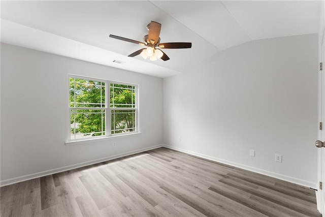 124 Oakmont Dr, Dawsonville, GA 30534 - unfurnished room with wood finished floors, ceiling fan, lofted ceiling, and baseboards