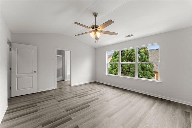 124 Oakmont Dr, Dawsonville, GA 30534 - unfurnished bedroom featuring light wood-type flooring, baseboards, vaulted ceiling, a ceiling fan, and ensuite bath