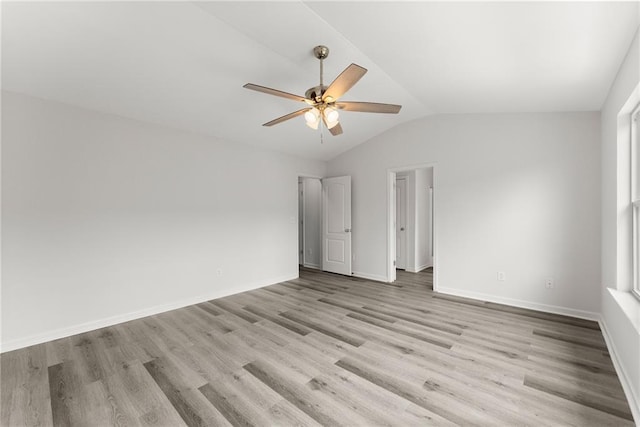 124 Oakmont Dr, Dawsonville, GA 30534 - unfurnished bedroom featuring lofted ceiling, light wood-style floors, baseboards, and ceiling fan