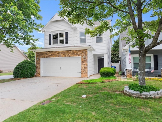 124 Oakmont Dr, Dawsonville, GA 30534 - view of front facade featuring a garage, stone siding, a front yard, and driveway