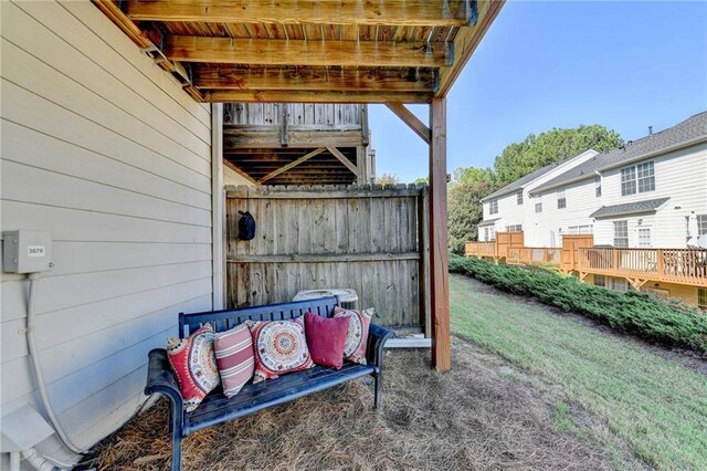 exterior space with central AC unit and a wooden deck