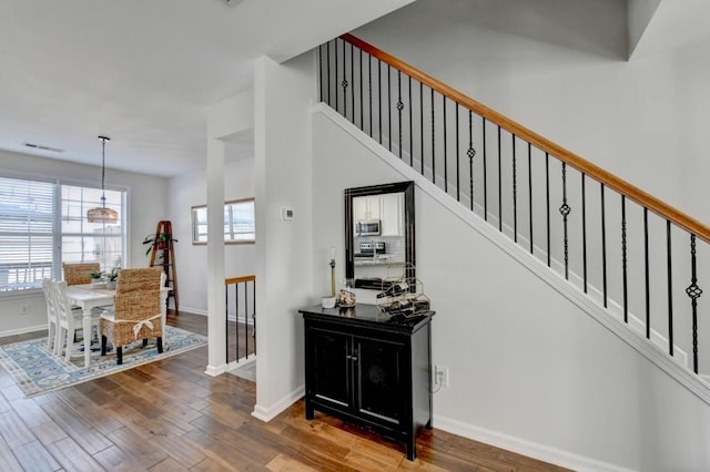 stairway featuring wood-type flooring