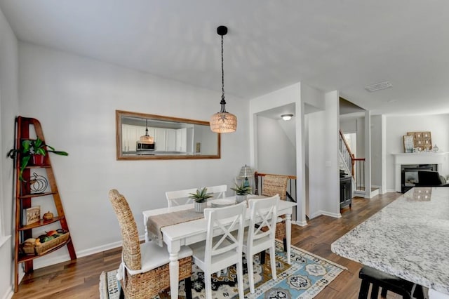 dining room featuring dark hardwood / wood-style flooring