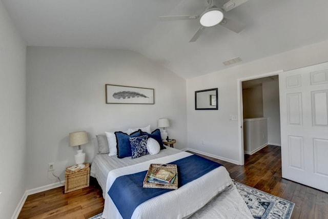 bedroom featuring ceiling fan, dark hardwood / wood-style flooring, and lofted ceiling