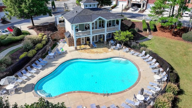 view of swimming pool with a patio area