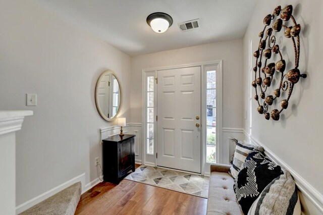 living room with ceiling fan and hardwood / wood-style flooring