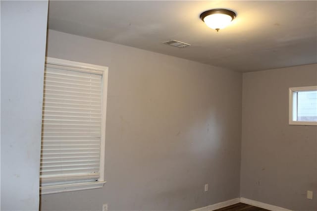 unfurnished room featuring hardwood / wood-style floors