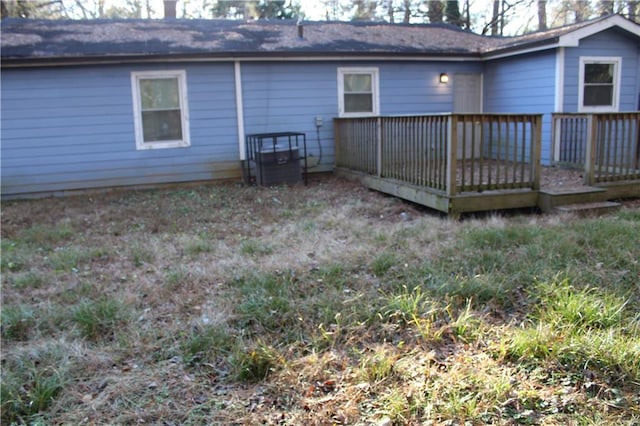 back of house with a wooden deck