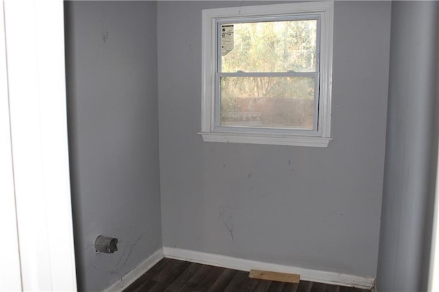 empty room with dark wood-type flooring