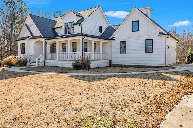 modern farmhouse style home featuring a garage and a porch