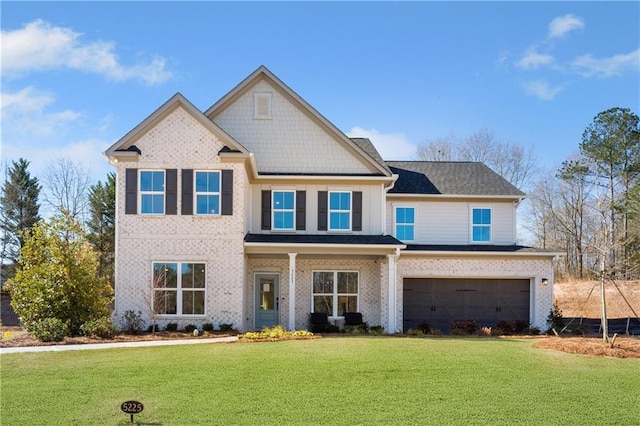 5360 Hyde Rd, Cumming, GA 30040 - view of front of home with an attached garage, a front lawn, and brick siding