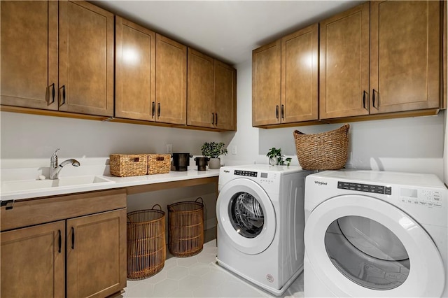 5360 Hyde Rd, Cumming, GA 30040 - laundry area featuring washing machine and dryer, cabinet space, and tile patterned floors