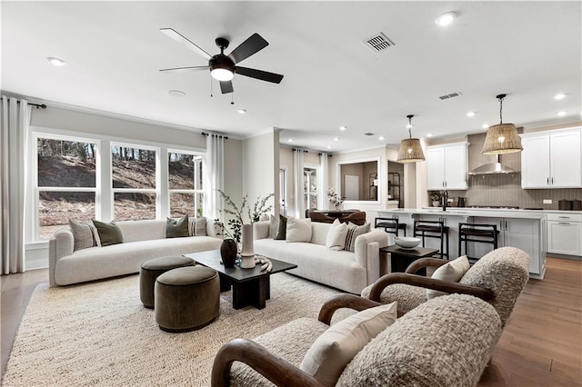 5360 Hyde Rd, Cumming, GA 30040 - living area featuring a ceiling fan, wood finished floors, and recessed lighting