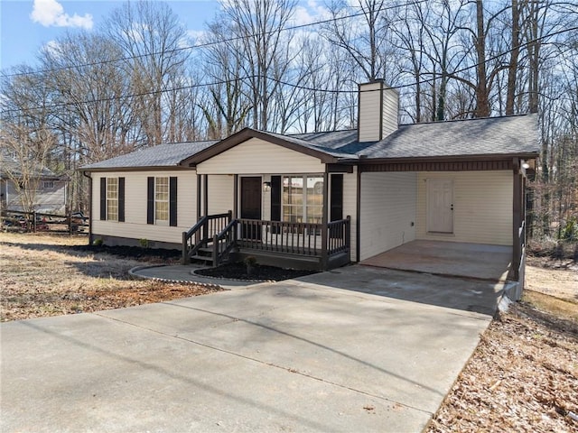 ranch-style house featuring a carport