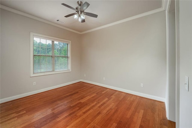 empty room featuring baseboards, light wood-style floors, crown molding, and a ceiling fan