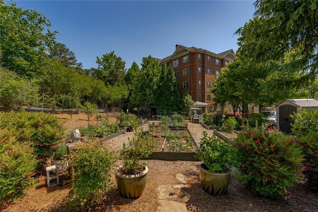 surrounding community featuring a garden, a shed, and an outdoor structure