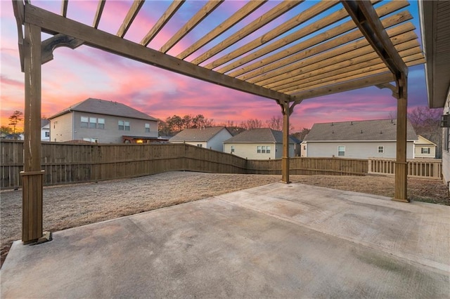 patio terrace at dusk with a pergola