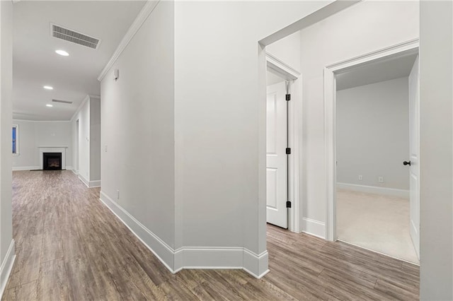 hallway with hardwood / wood-style floors