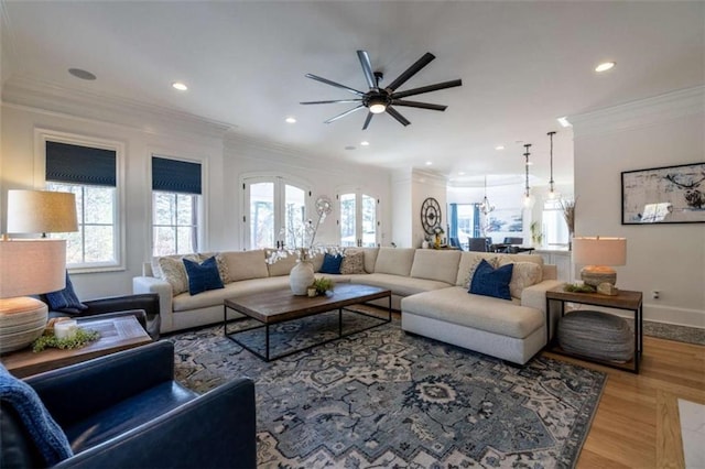 living room with french doors, ornamental molding, and wood-type flooring