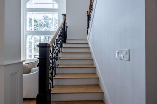 stairway featuring a wealth of natural light