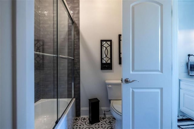 2938 Old Dalton Rd, Rome, GA 30165 - bathroom featuring enclosed tub / shower combo, toilet, tile patterned floors, and baseboards