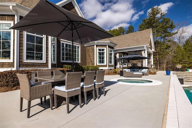 view of patio featuring an outdoor hangout area and a jacuzzi