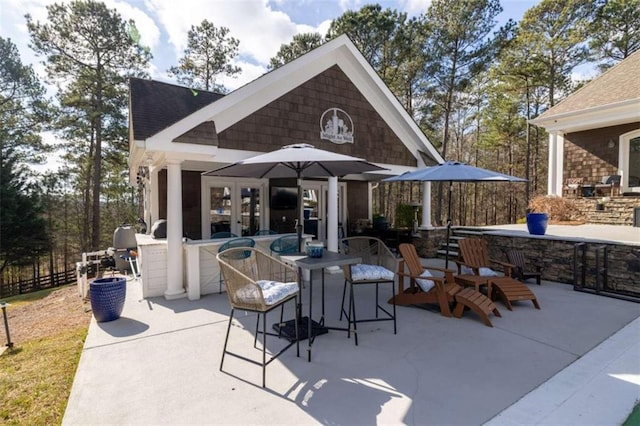 view of patio / terrace with a bar and french doors