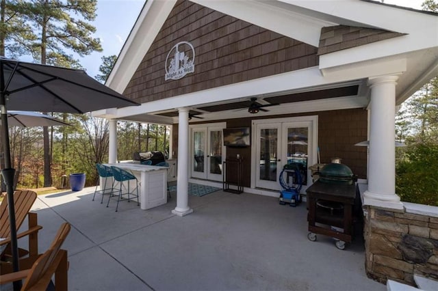 view of patio with french doors and ceiling fan