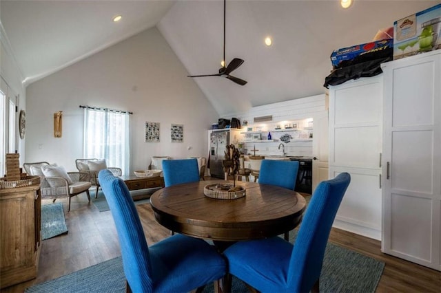 dining area featuring ceiling fan, high vaulted ceiling, dark hardwood / wood-style floors, and sink