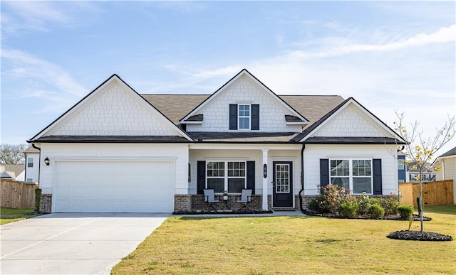 craftsman-style house with a garage and a front lawn