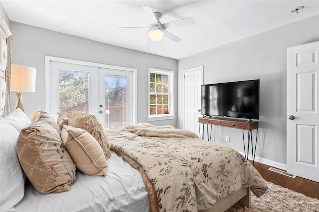 bedroom with access to exterior, multiple windows, french doors, and visible vents